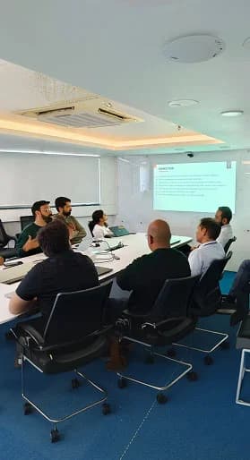 Team meeting with presentation screen